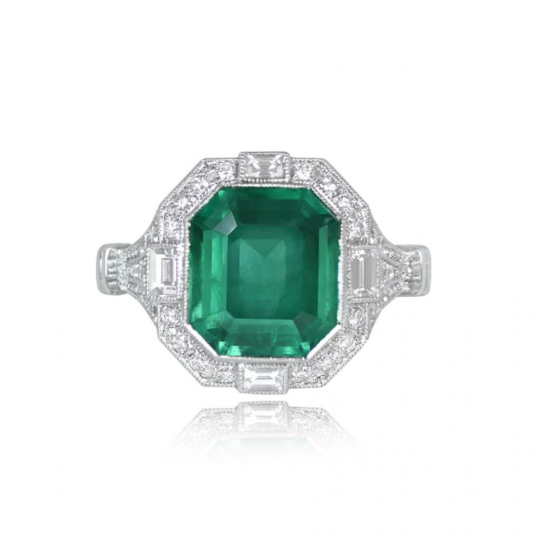 3.88ct Emerald and Diamond Halo Platinum Ring.