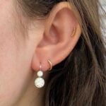 Chancellor earrings featuring two bezel-set old European cut diamonds