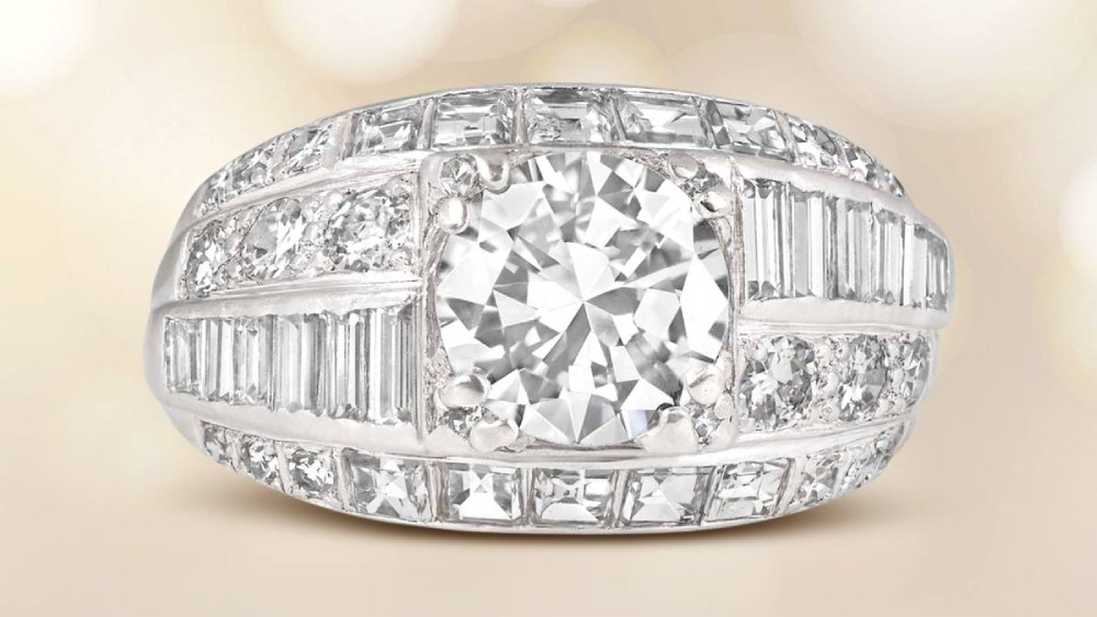 A large Diamond ring featuring four rows of various diamond cuts.