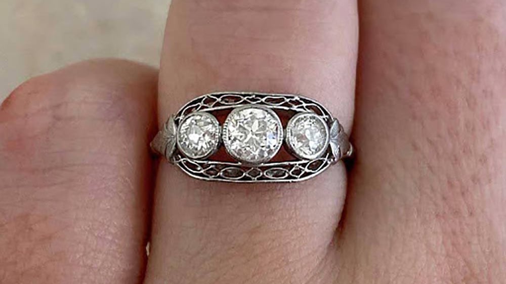 Three stone old European cut diamonds set in platinum east to west horizontal setting