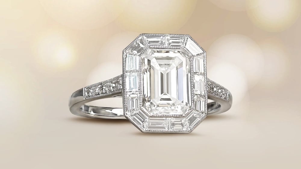 An emerald cut diamond ring with a diamond halo.
