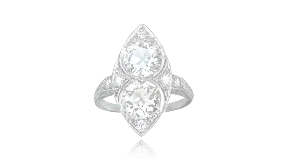 A navette ring featuring two central diamonds.