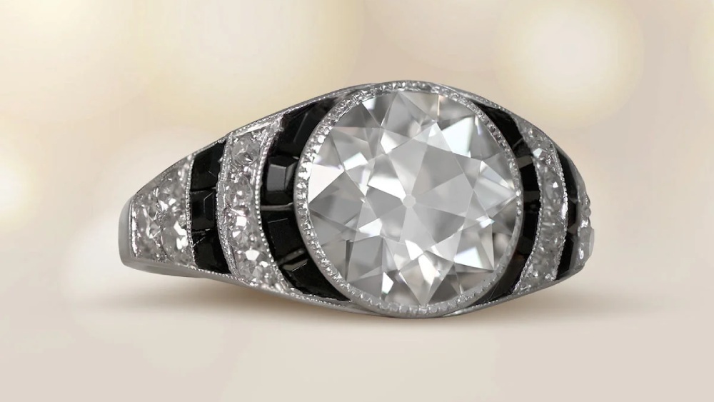 A rounded diamond ring with alternating strips of diamonds and onyx.