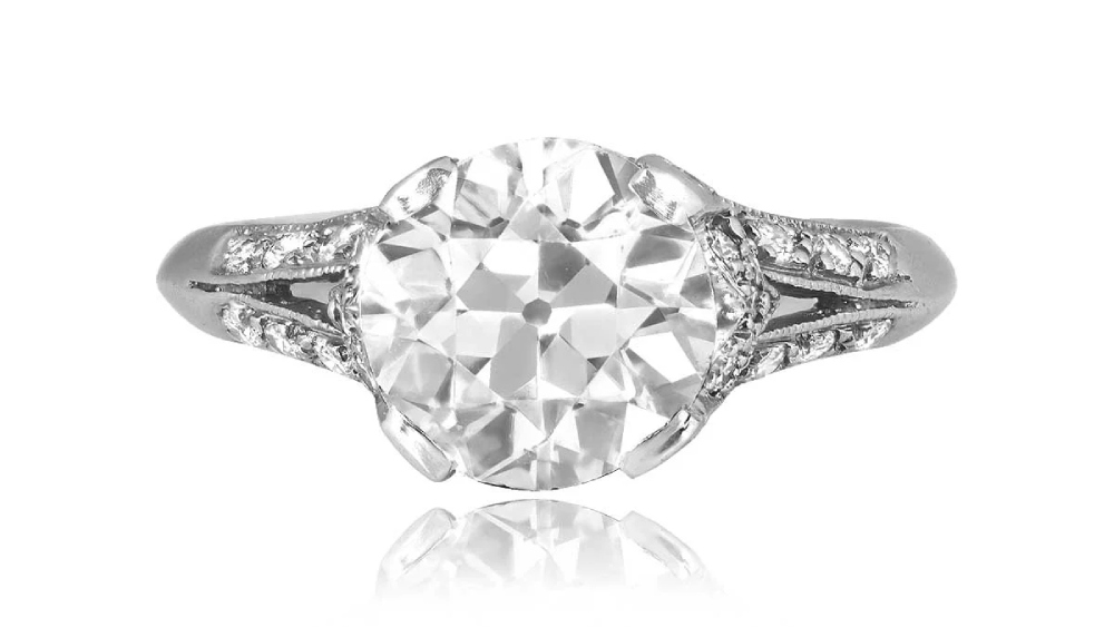 A high-profile diamond ring with diamond-set split shoulders.