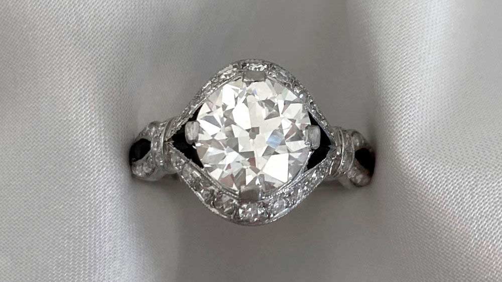 An Art Deco diamond ring with black onyx accents.