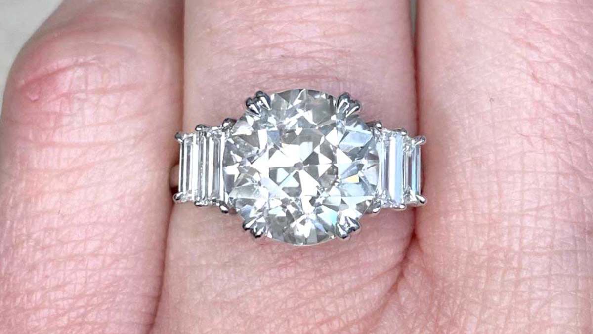 center 4.26 carat prong set diamond with baguette diamond accents