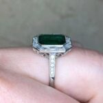 Alanya Ring showcasing an emerald bezel-set in platinum