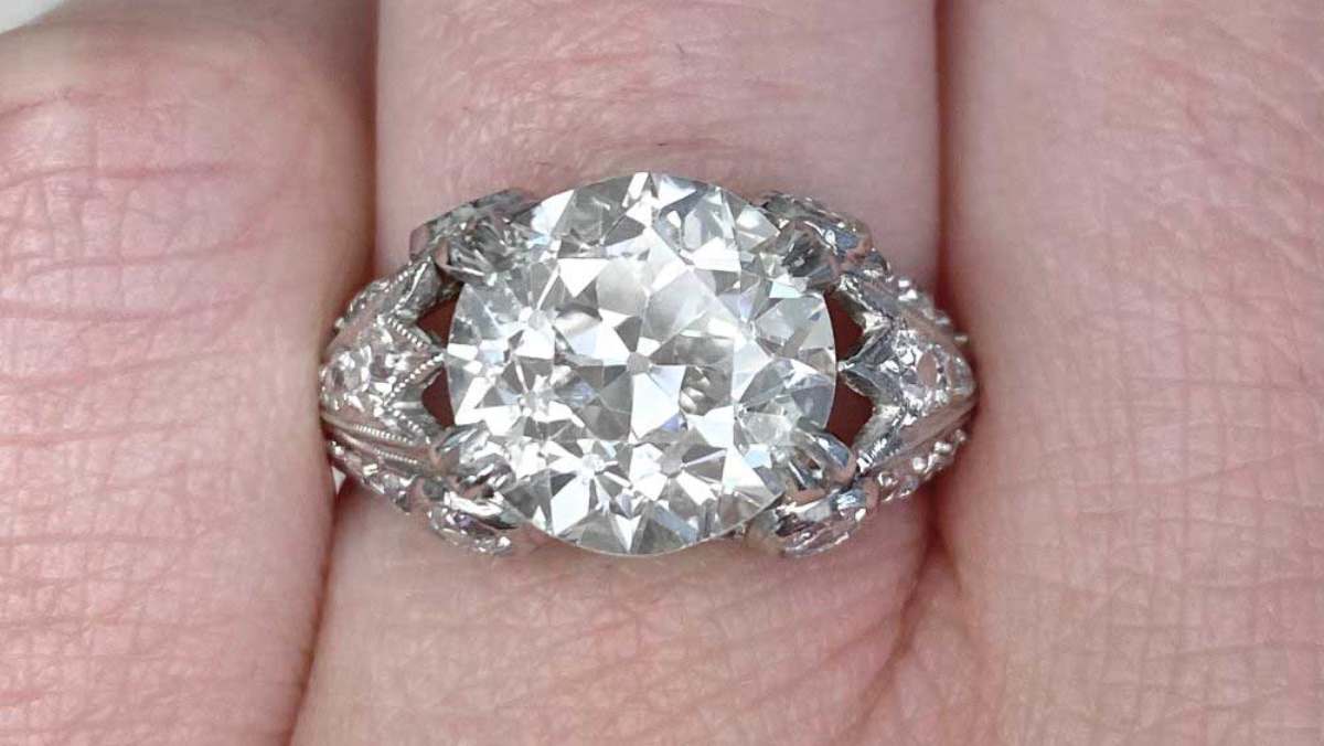 center old European cut diamond weighing 4.22 carats ring with intricate detailing