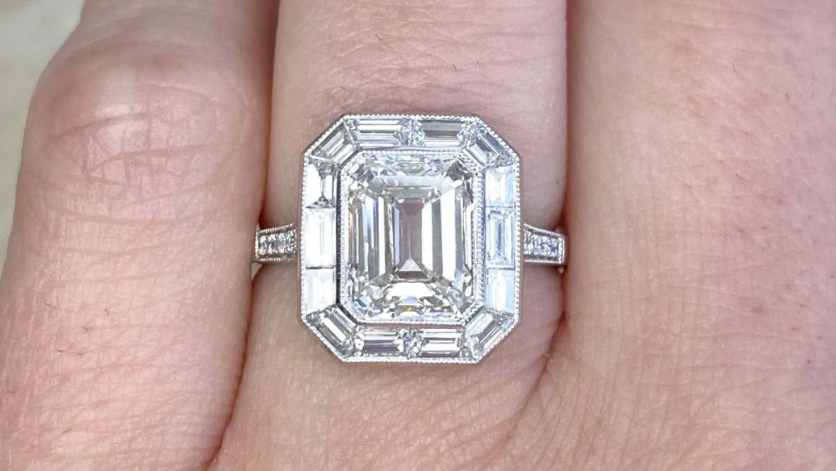 3ct center emerald cut diamond with baguette diamond halo