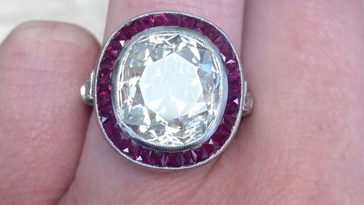 7.00 carat diamond with French cut ruby halo platinum ring