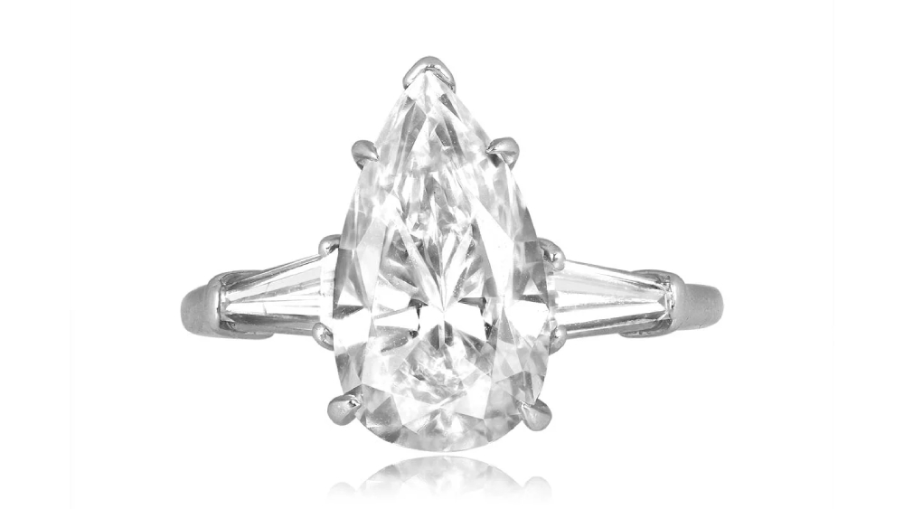 A pear-shaped diamond ring and tapered-baguette diamond shoulders.