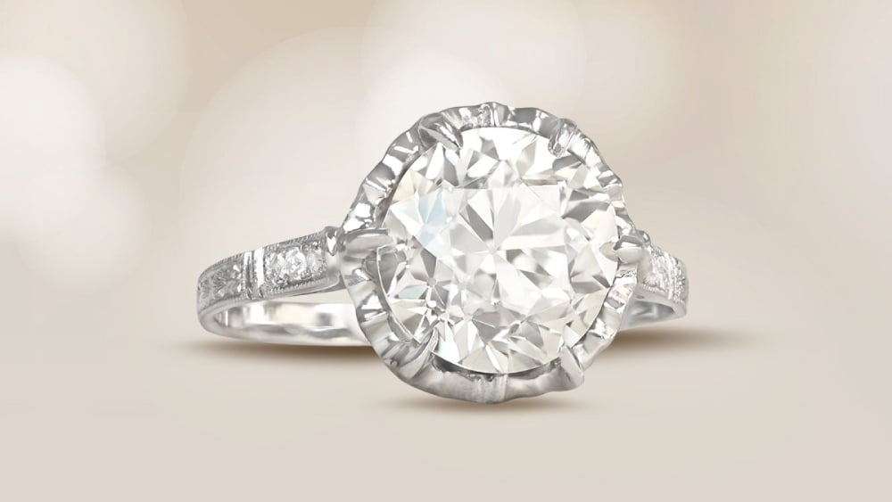 An antique platinum ring with a prong set diamond.