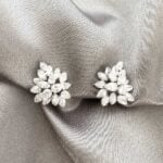 pair of diamond cluster earrings featuring pear-shaped and marquis-shaped diamonds