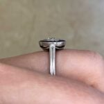 Virden Ring surrounded by a halo of natural blue French cut diamonds