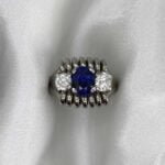 Midvale Ring with a spiral shape enhancing the three stones