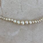 Birnam Necklace set with a strand of natural saltwater pearls