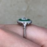 Bally Ring with emeralds surrounding the center stone