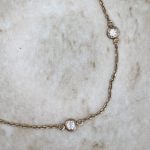 Cranston Necklace featuring ten bezel set round brilliant cut diamonds