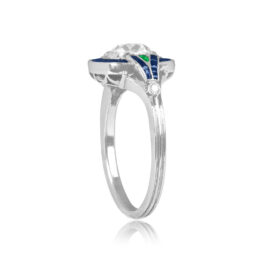 cushion cut diamond engagement ring with sapphire and emerald