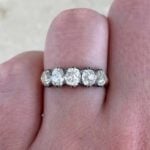 five-stone ring featuring antique cushion cut stones