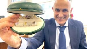 Afshin with colored diamond rings in ring box Jewelry