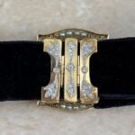 necklace featuring old cut diamonds and seed pearls