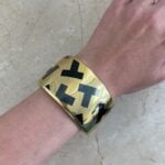 bangle with each side showcasing a reversed color design