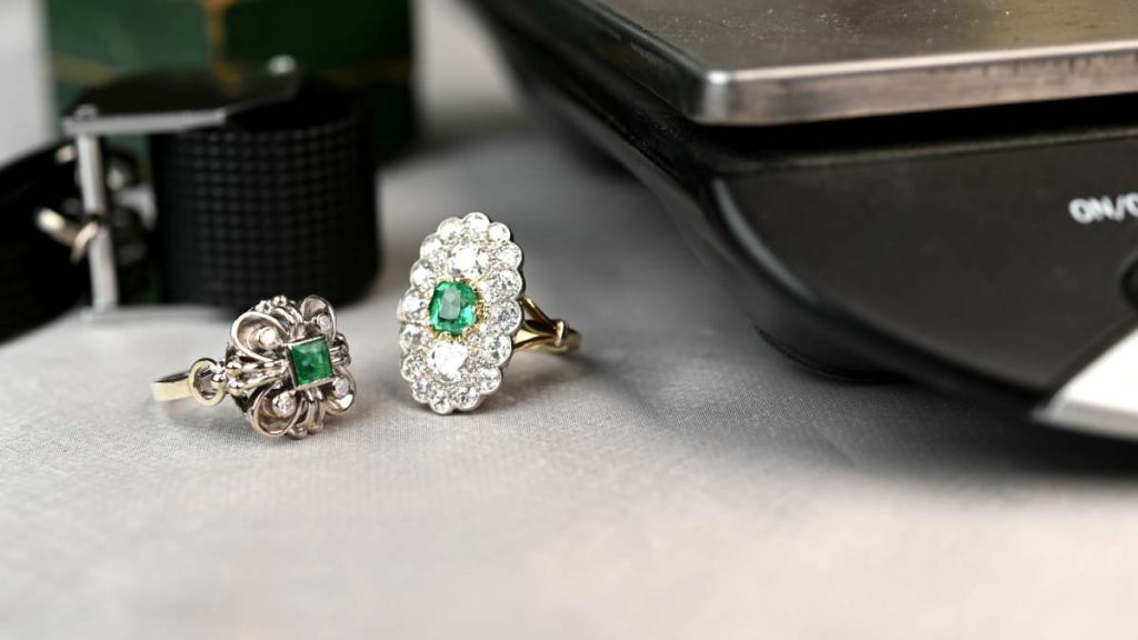 Measuring and loupe for two emerald Zambian rings