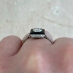 ring featuring a bezel set 0.20 carat old European cut diamond