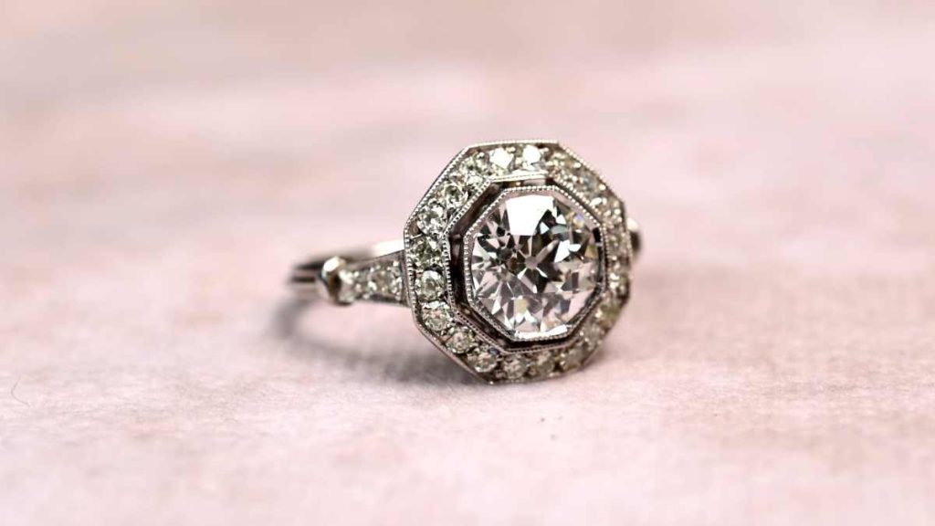 K Color Diamond surrounded by yellowish halo