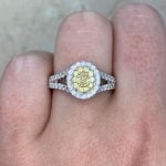 0.63ct Oval Yellow Diamond Double Halo Ring on Finger F2