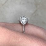 Firestone Ring with a diamond halo surrounding the center stone