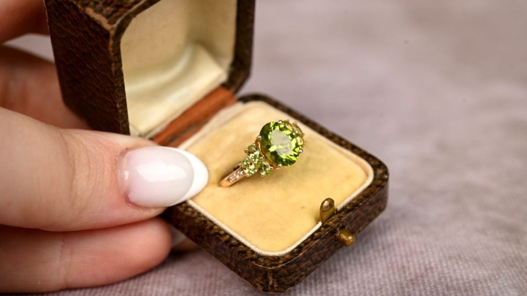 Peridot and Diamond Birthstone Ring and Box Held