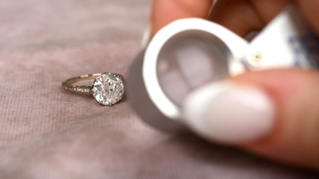 SI2 Clarity Diamond Engagement Ring and Jewelers Loupe