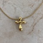 Tiffany necklace featuring a bubble T shaped pendant on a gold chain