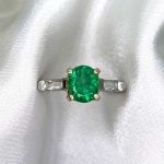 1.29ct oval cut emerald with diamonds on shoulders White Backdrop f5 ROC104