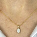 Arbala Necklace features an oval cut 0.79 carat opal pendant