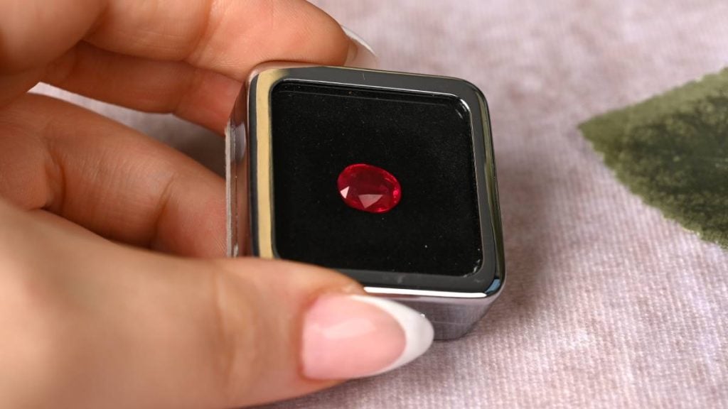 Jeweler Holding Rare 2ct Unheated Burma Ruby in Gemstone Box