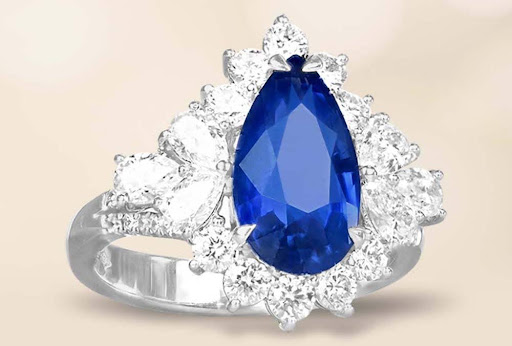 pear shaped sapphire diamond ring in platinum with diamonds