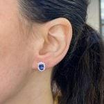 earrings centering two oval cut sapphire stones