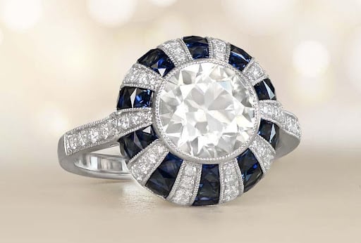 old eueopean cut diamond ring in platinum with sapphire accents