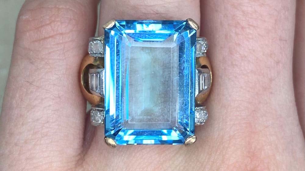 Retro era 1940 ring with an aquamarine stone and baguette cut diamonds set in platinum and 18k yellow gold
