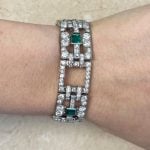 Cartier bracelet features a geometric link design highlighting emerald cut emeralds