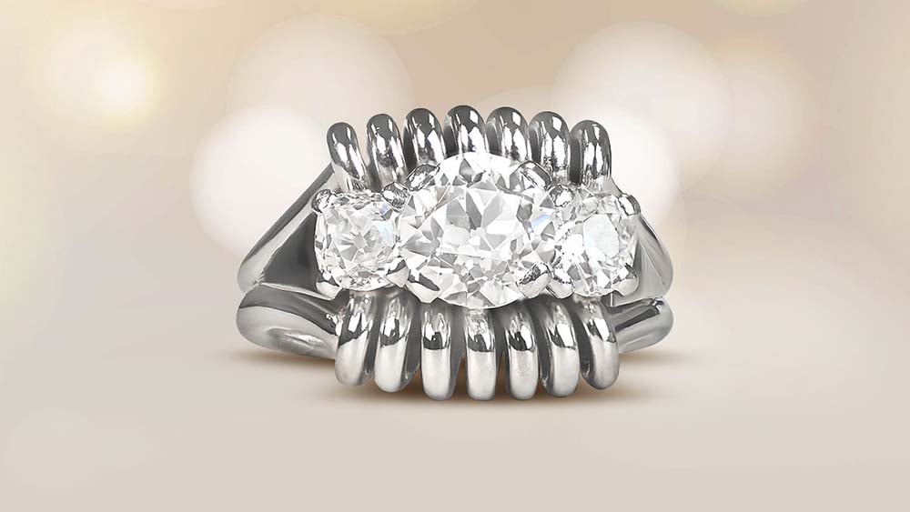 Retro era 1950 ring with an old European cut diamond and spiral frames in 18k white gold