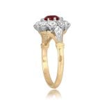 center 0.70 carat ruby stone surrounded by diamond cluster Sentinel Ring 16033