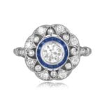 center old european cut diamond with sapphire halo and floral openwork design Ririe Ring 16041