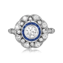 center old european cut diamond with sapphire halo and floral openwork design Ririe Ring 16041