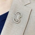 Cartier brooch featuring a symmetrical design adorned with diamonds