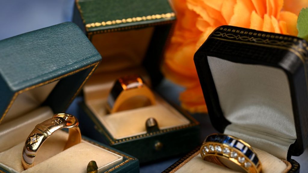 Gold Rings with Gemstones in Boxes Closeup