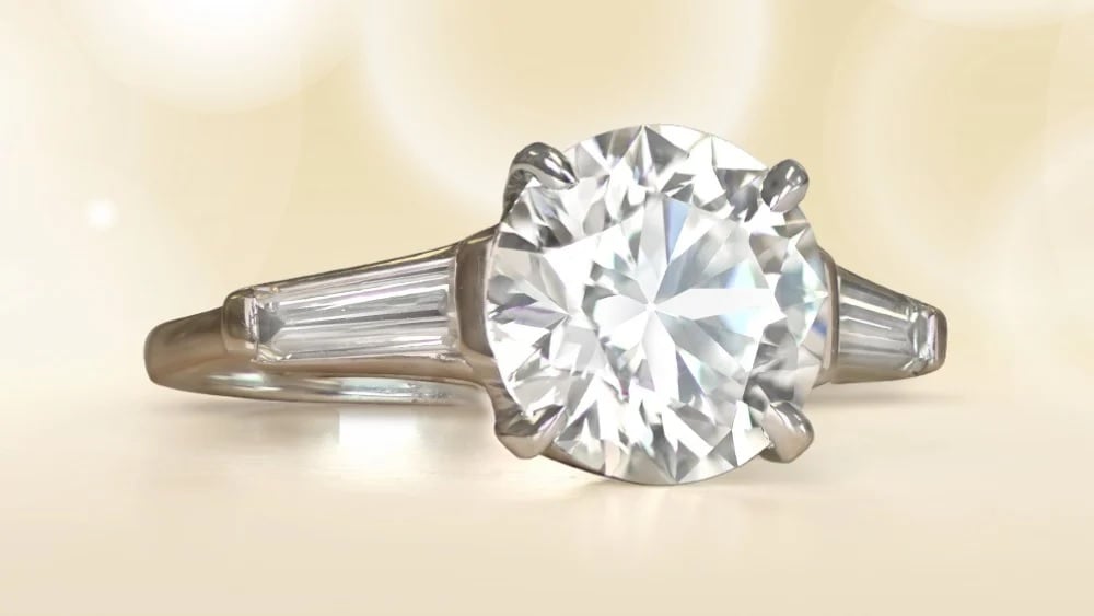 vintage diamond ring in platinum with baguette cut side diamonds